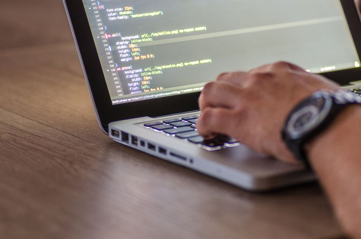 Developer writing and reviewing application code