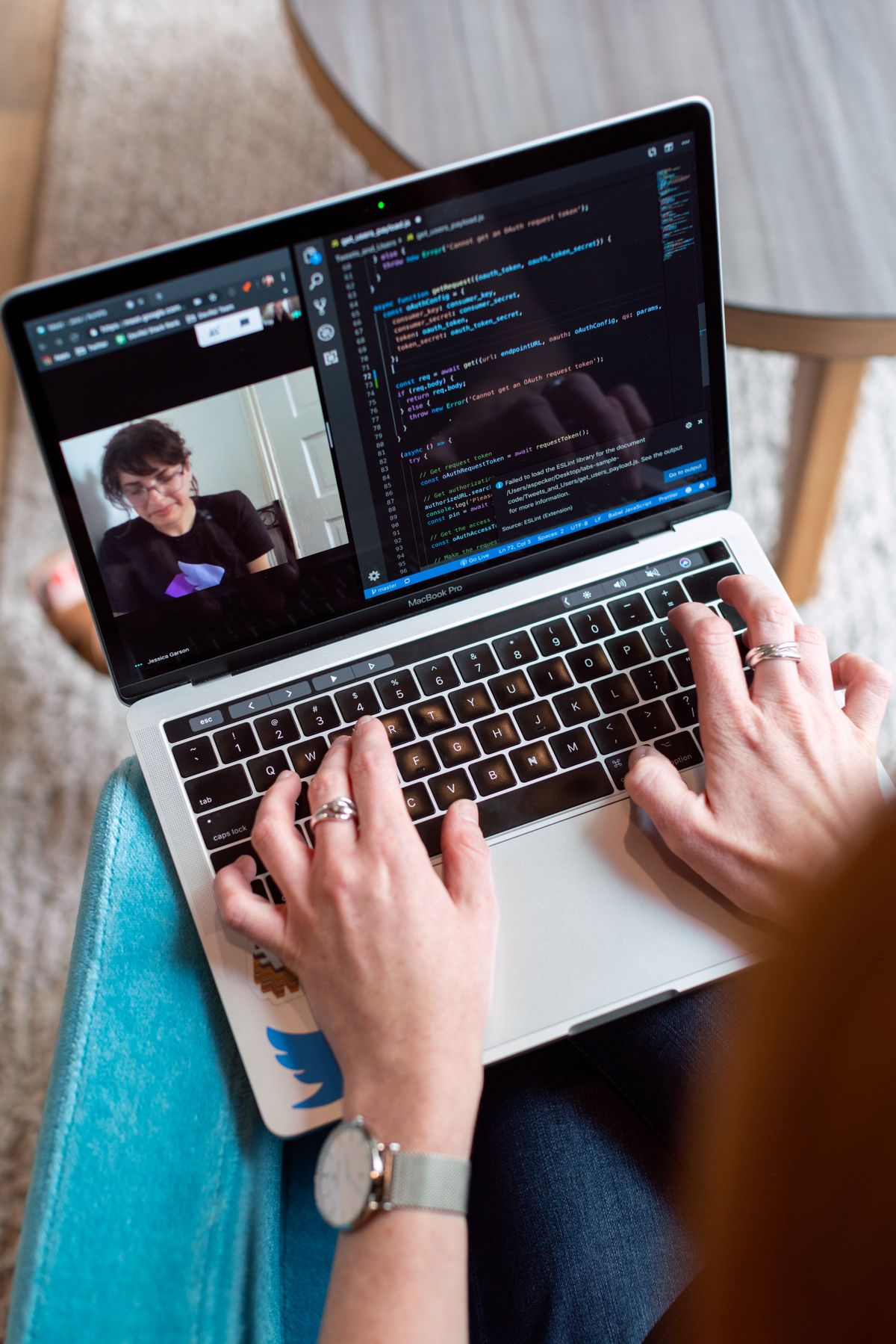 Developer working through existing application code with a colleague